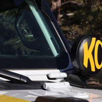 KC HiLiTES 6in. Round Soft Cover (Pair) - Black w/Yellow KC Logo